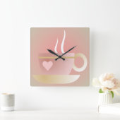 Roze theekopje en wandklok van het hart (Huis)