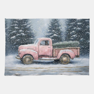 Roze truck die een kerstboom vervoert theedoek