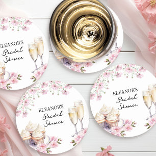 Roze wilde bloemen champagneglazen en cupcakes ronde kartonnen onderzetter