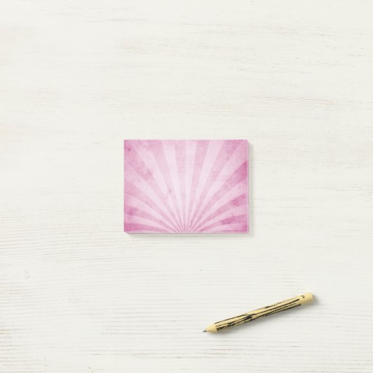 Roze zonnestralen post-it® notes (Op bureau)