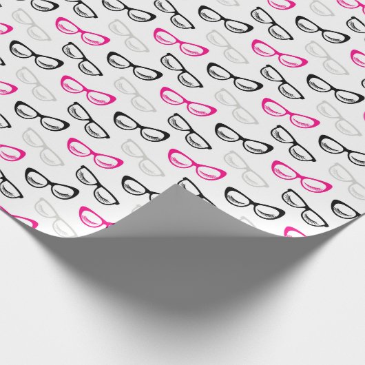 Roze, zwarte en grijze bril en as cadeaupapier (Hoek)