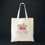 Rozen Waterverf Floral Wedding Tote Bag<br><div class="desc">Een trouwende canvas tas met een fantastische florale bouquet met waterverf rozen. Stijlvol,  grillig en creatief. Een bundel rozen in roze,  paars en geel. Met veel sprigs en bladeren in groen,  roze,  paars en blauw. De achtergrond is een van-witte champagnekleur. 2 gouden trouwringen onder de tekst.</div>