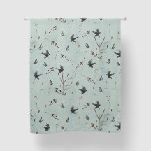 Rune Algiz gemaakt van takken met een kraai