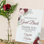 Rustic Red Boho Floral Onderteken ons gastboek Reclamebord Met Voetstuk<br><div class="desc">Dit prachtige voetstuk nodigt uw bruiloftsgasten uit om uw gastenboek te ondertekenen. Beschikt over een rustiek boho bloemenontwerp met handgeschilderde waterverf rozen in de tinten bordeaux,  rood en blozend roze. Er is ruimte voor de namen van het paar en de trouwdatum.</div>