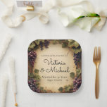 Rustic Vineyard Grapes Custom Name Papieren Bordje<br><div class="desc">These custom party or event plates feature an elegant, Tuscan style vineyard theme with purple grapes hanging from vines. The background features a rustic parchment paper design. They're perfect for a wine tasting, anniversary celebration, or other special event. You can personalize the plates to include your own custom text and...</div>