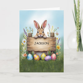 Rustiek teken konijn in gras met paaseieren kaart
