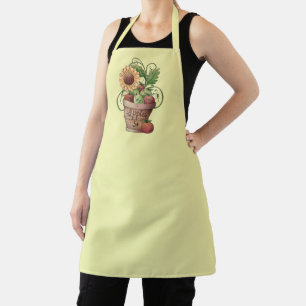 Rustieke mand van rode & groene appels & zonnebloe schort