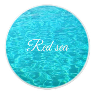 Rustig water van rood zee keramische knop