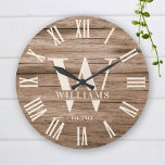 Rustige Monogram Farmhouse - Aangepaste familienaa Grote Klok<br><div class="desc">Personalized Family Name, monogram, and year established Rustic Modern Wall clock in a trendy farmhouse design design with roman numeral clock face and light white wood plank / shiplap backdrop design. Perfect gift for newlyweds, wedding or housewarming present or grandouders gift, or for a home make-over in your cabin, cottage,...</div>