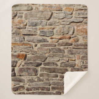 Rustige textuurachtergrond van steenwand sherpa deken