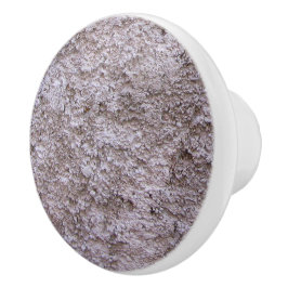 Ruw onbewerkte beton grijze bouwmuur keramische knop