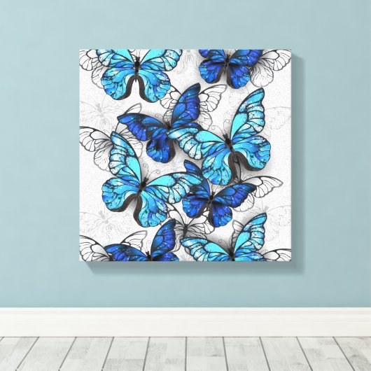 Samenstelling van witte en blauwe vlinders canvas afdruk (Insitu (Houten vloer))