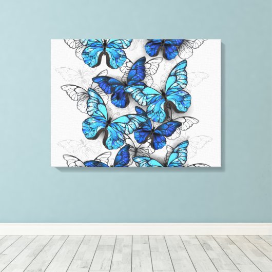 Samenstelling van witte en blauwe vlinders canvas afdruk (Insitu (Houten vloer))
