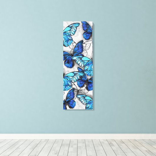 Samenstelling van witte en blauwe vlinders canvas afdruk (Insitu (Houten vloer))