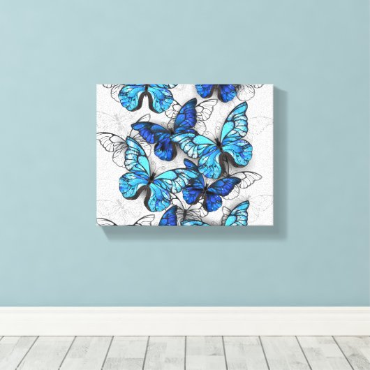 Samenstelling van witte en blauwe vlinders canvas afdruk (Insitu (Houten vloer))
