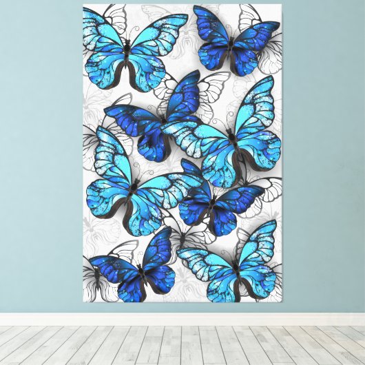 Samenstelling van witte en blauwe vlinders canvas afdruk (Insitu (Houten vloer))