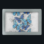 Samenstelling van witte en blauwe vlinders gesp<br><div class="desc">Verticale samenstelling van realistische,  blauwe en witte morfovlinders op grijze getextureerde achtergrond. Morpho blauwe vlinder.</div>