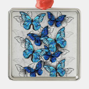 Samenstelling van witte en blauwe vlinders metalen ornament