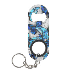 Samenstelling van witte en blauwe vlinders mini flessenopener