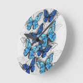 Samenstelling van witte en blauwe vlinders ronde klok (Hoek)