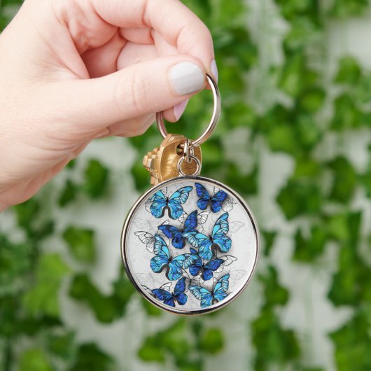 Samenstelling van witte en blauwe vlinders sleutelhanger (Hand)