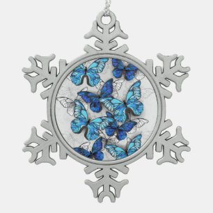 Samenstelling van witte en blauwe vlinders tin sneeuwvlok ornament