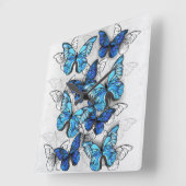 Samenstelling van witte en blauwe vlinders vierkante klok (Hoek)