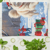 Samojed die in de sneeuw rent met een kerstmuts theedoek (Gevouwen)