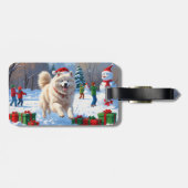 Samojed die in de sneeuw rent met kerstmuts bagagelabel (Achterkant horizontaal)