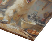 Samojed kookt in de keuken snijplank (Hoek)