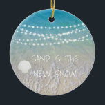 Sand Is The New Snow Beach Christmas Ornament<br><div class="desc">This fun beach living design Sand is the new snow ornament features a beach scene with a seashell and string lights handing across the top. Personalize by adding a year.</div>