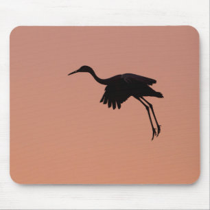 Sandhill silhouette op een roze zonnehemel muismat