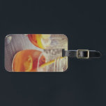 Sangria and Sunshine Bagagelabel<br><div class="desc">This image shows a refreshing glass and pitcher of citrus sangria, perfect for a warm day. The fresh slices of lemon and orange add bright colour and hint of natural sweetness. One glass sits ready to enjoy while sangria is being poured from a small glass pitcher beside it, perfect for...</div>