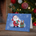 Santa Chocolate Lab Rendier Joy Laughter Feestdagen Kaart<br><div class="desc">Dit is een geweldige kerstkaart om naar iedereen te sturen om een glimlach op hun gezicht te plaatsen zoals de kerstman hier dit vakantieseizoen. Op de voorzijde van de kaart is een illustratie van de Kerstman lachen als hij reageert op het zien van zijn chocolade Lab het dragen van een...</div>