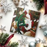 Santa Christmas Dragon Fantasie Tegeltje<br><div class="desc">Kerstman met een jonge groene draak op schoot. Santa's hol is gevuld met een zak speelgoed,  baby griffin,  baby witte eenhoorn en twee katten in boekenplanken. Achter is een open haard,  boekenplanken gevuld met boeken en wandtapijt van een sneeuwman</div>