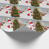 Santa claus and reindeer behind a christmas tree.j cadeaupapier (Hoek)