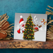 Santa claus en rendier achter een kerstboom.j fotoplaat (Zijkant)