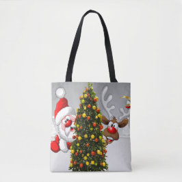 Santa claus en rendier achter een kerstboom.j tote bag