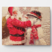 Santa claus en sneeuwpop in sneeuwval fotoplaat (Voorkant)