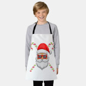 Santa claus heeft een zonnebril met zoete suikerri schort (Gedragen)