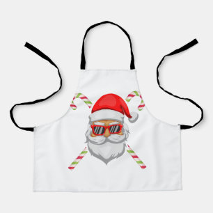 Santa claus heeft een zonnebril met zoete suikerri schort