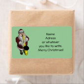 Santa Claus-speelsaxophone Etiket (Insitu)