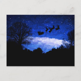Santa Claus vliegt door een kerstcadeautje Briefkaart