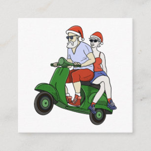 Santa en mevrouw Claus rijden op een scooter Informatiekaartje