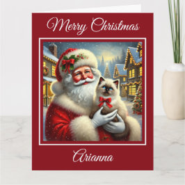 Santa en Ragdoll Kitten in het kerstdorp Kaart