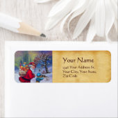 SANTA MET TOYS EN KIND IN DE WINTERSNEEUW ETIKET (Insitu)