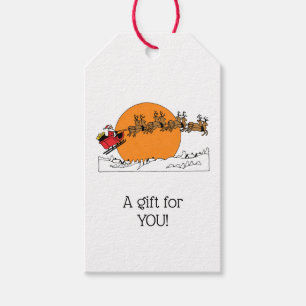 Santa Reindester over sneeuwbedekking Cadeaulabel