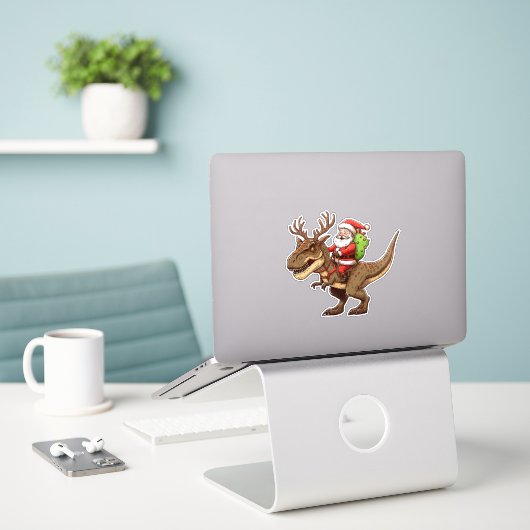 Santa Riding Dinosaur T-Rex  Sticker (Laptop op bureau)