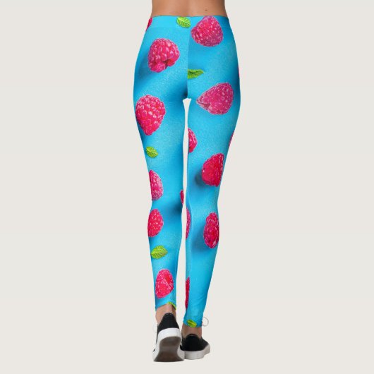 SAPPIGE RODE LYCHEE OP BLAUWE ACHTERGROND LEGGINGS (Achterkant)