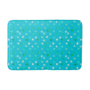 Satin sterren, bleek groen en blauw op turquoise badmat